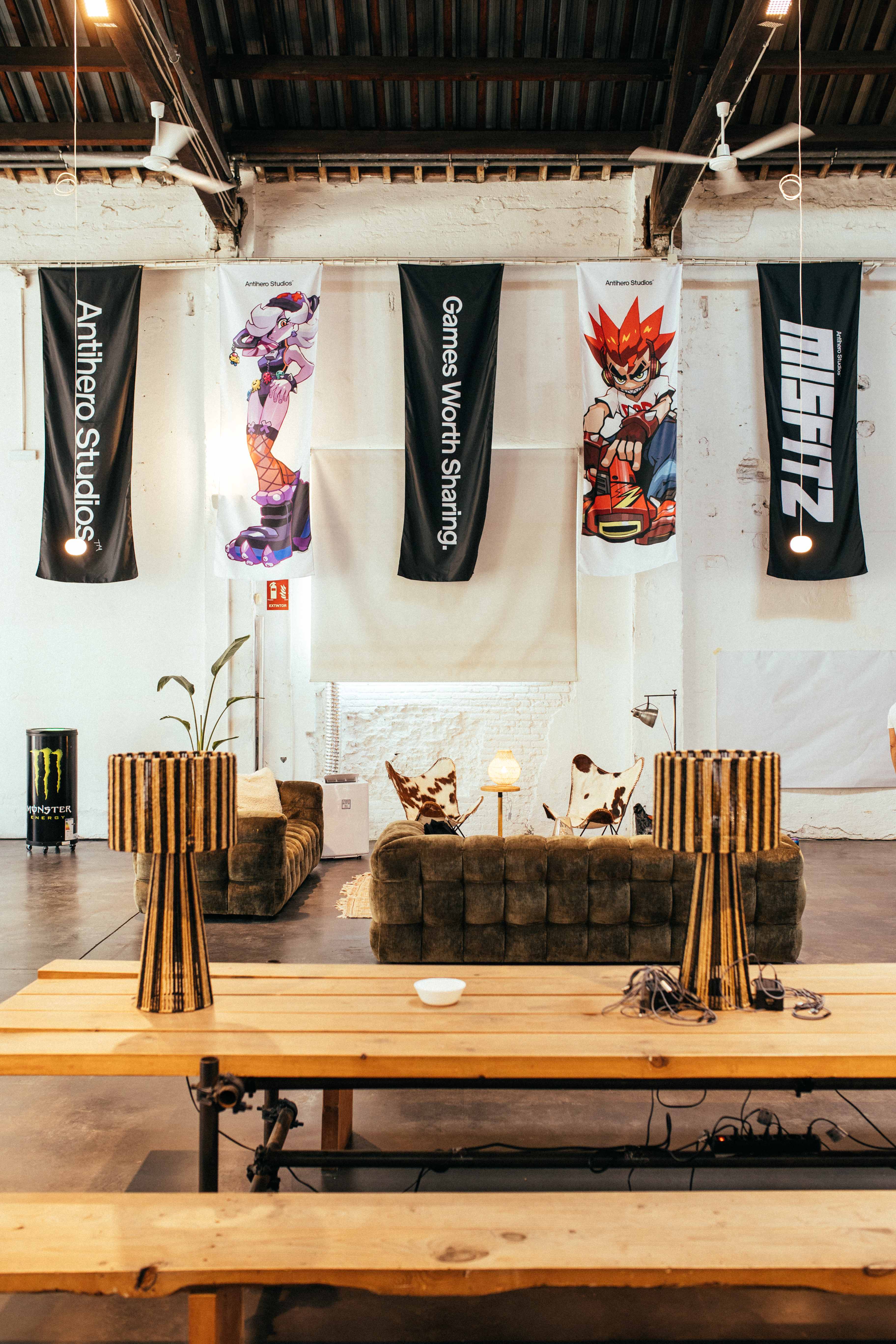 A view of the event lounge with Antihero Studios and Misfitz banners.