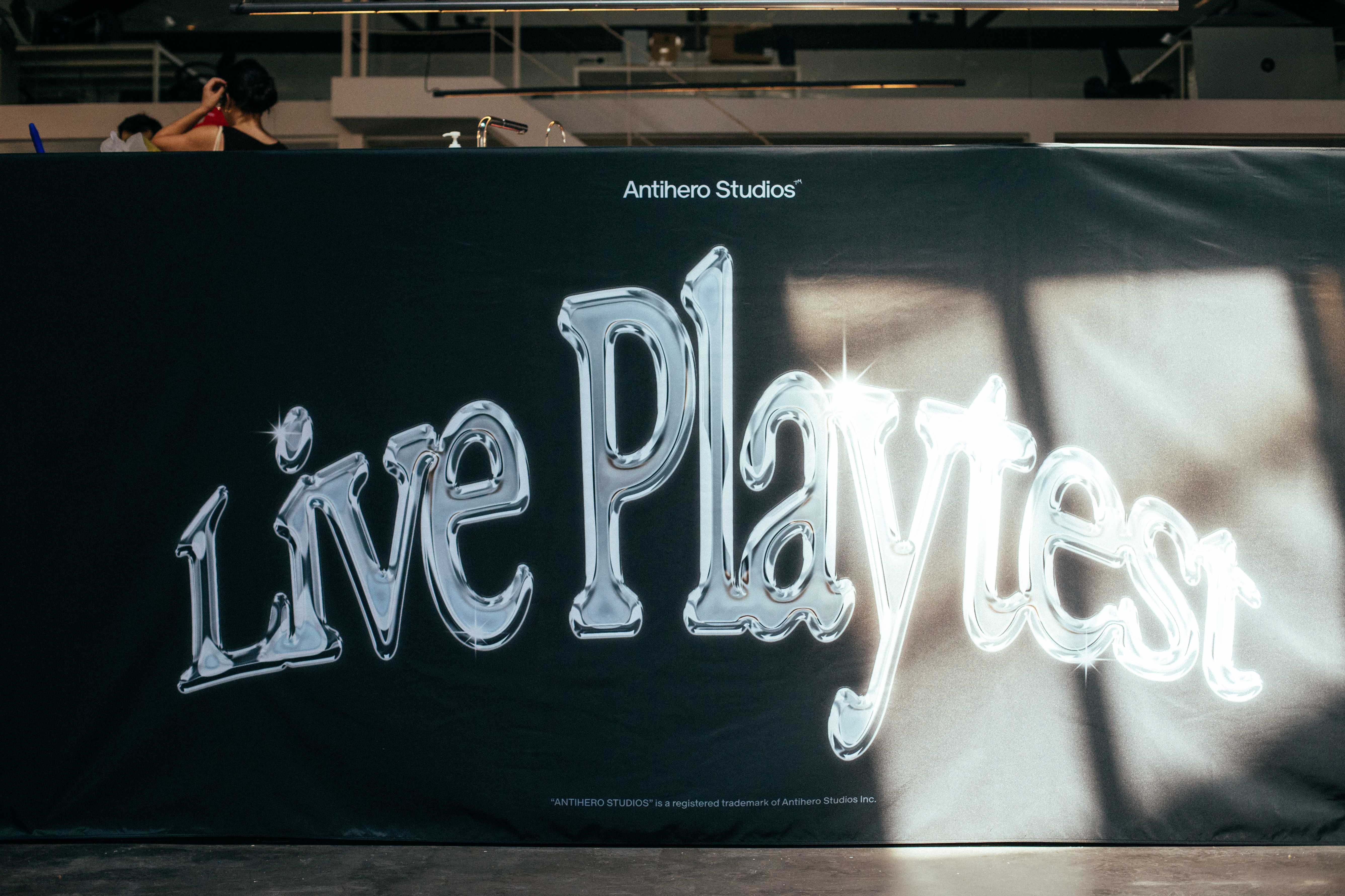 A large banner with the text 'Live Playtest' in a shiny, chrome-like font.